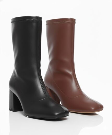 أناقة مزدوجة: بوت الكاحل باللونين الهافان والأسود - إطلالة لا تُنسى!